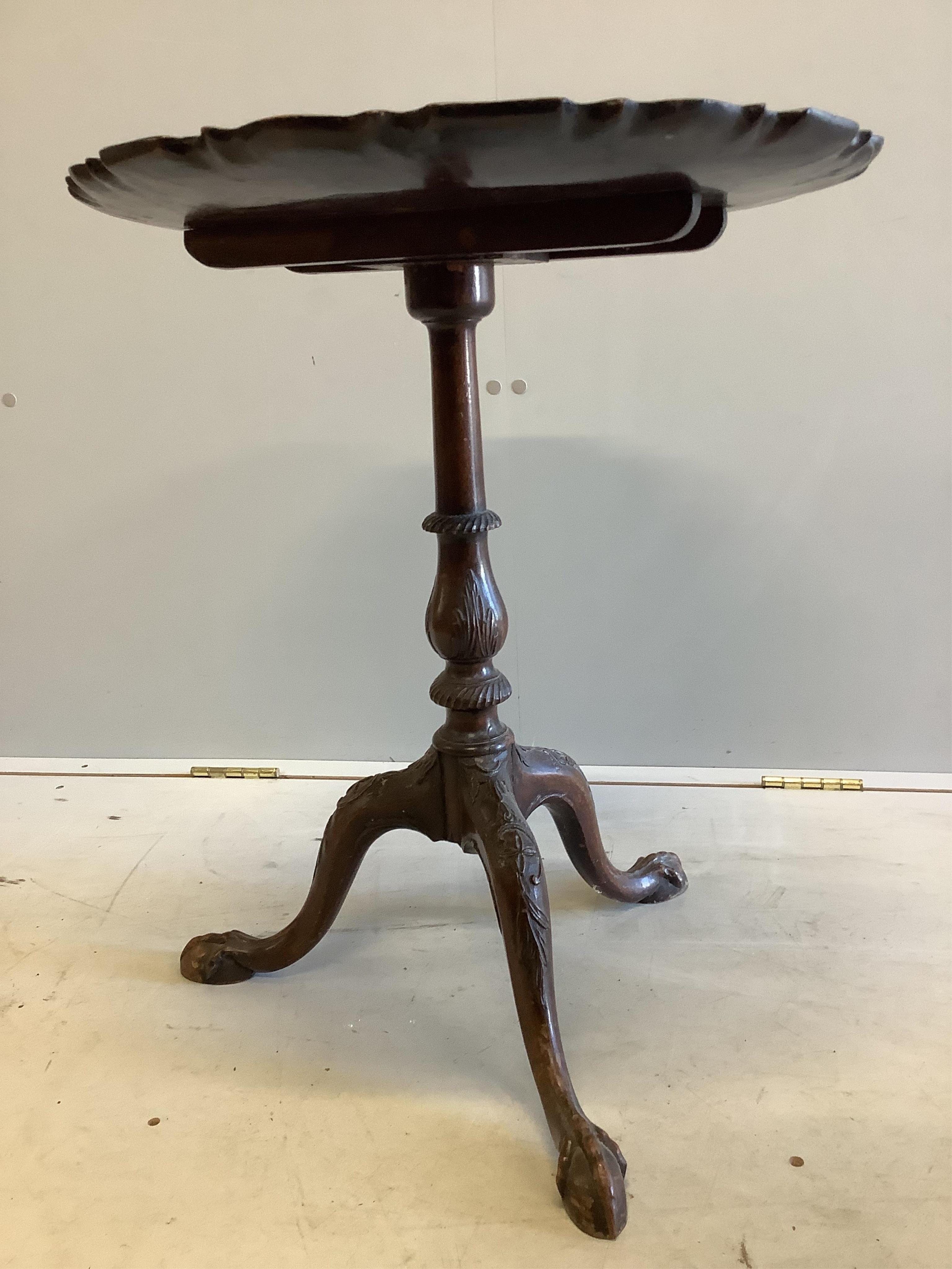 A George III style circular mahogany tripod wine table, diameter 52cm, height 62cm. Condition - fair